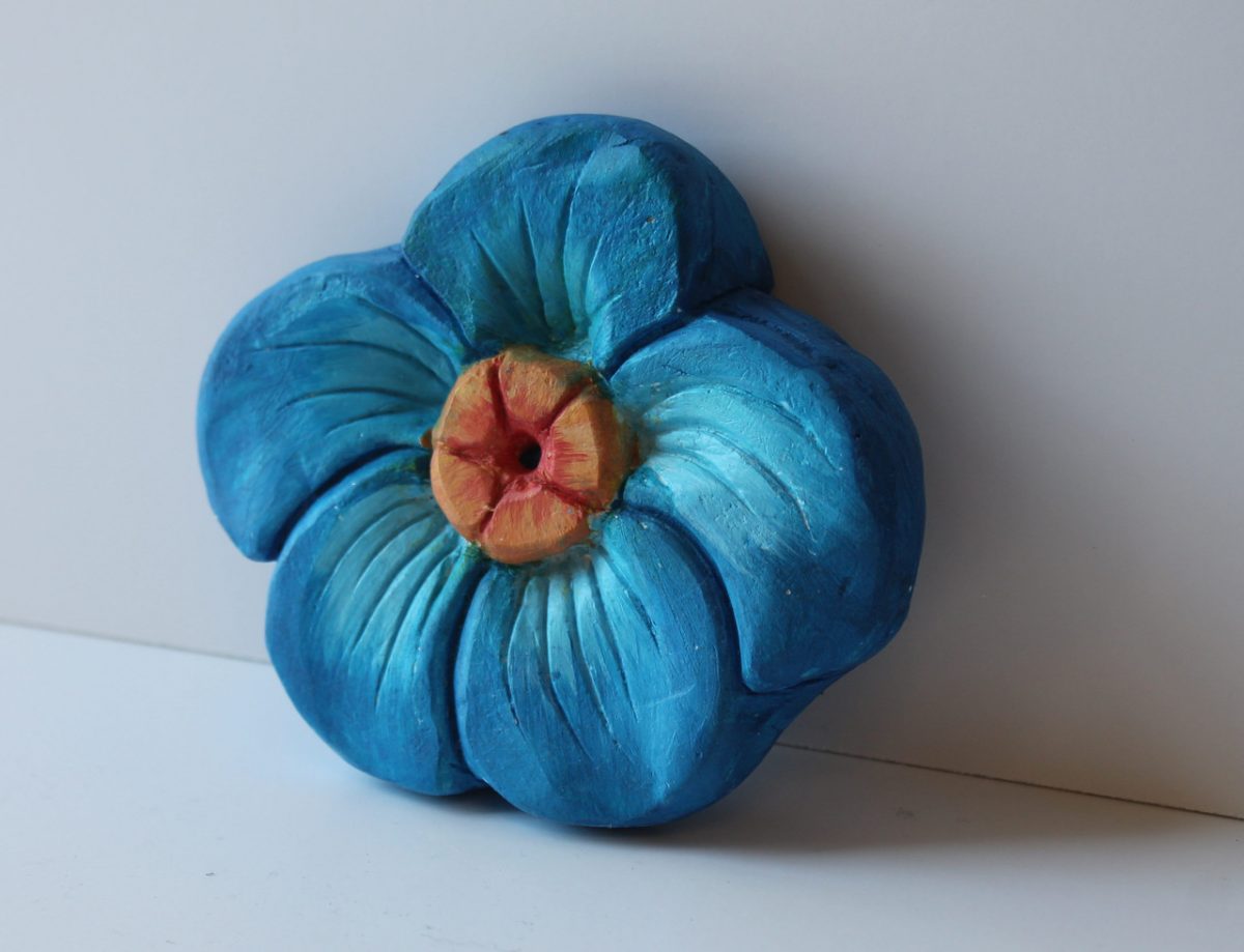 A sculpture of a blue flower.