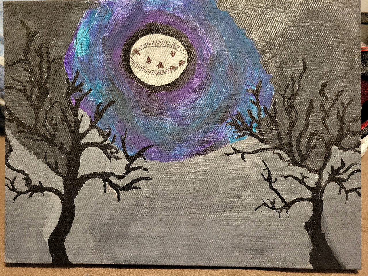 A moon and two trees.