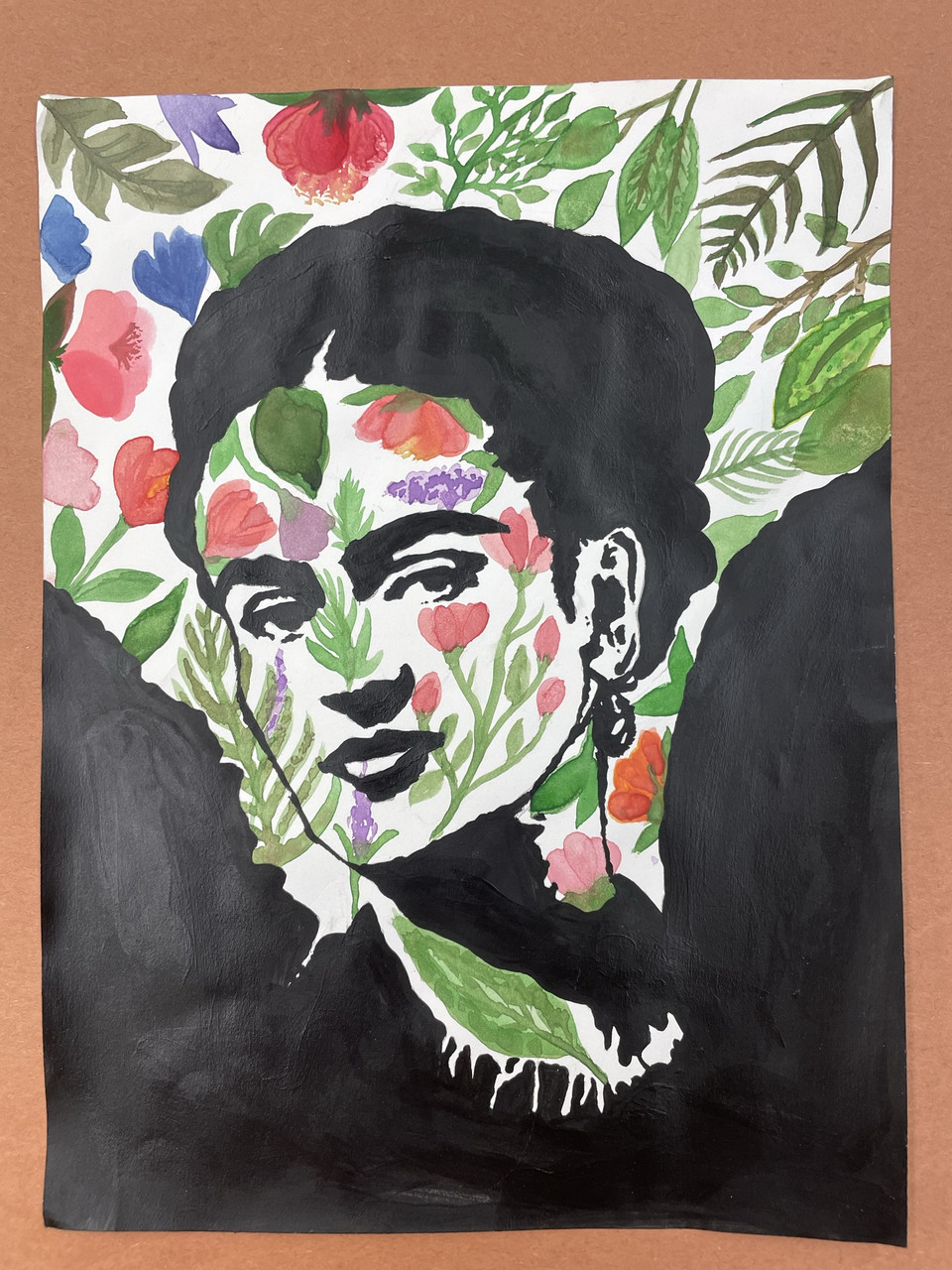 Sharpie portrait of Frida Kahlo's head and neck drawn over a green and red floral background.