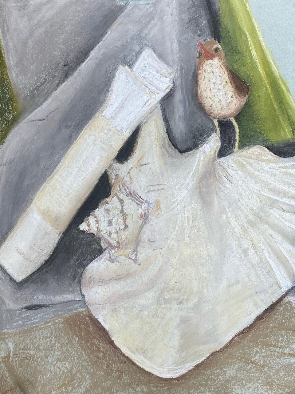 A still life created with chalk on paper. A white sea shell is drawn on the bottom right corner with a small bird standing on top of it. There is green and gray fabric behind.