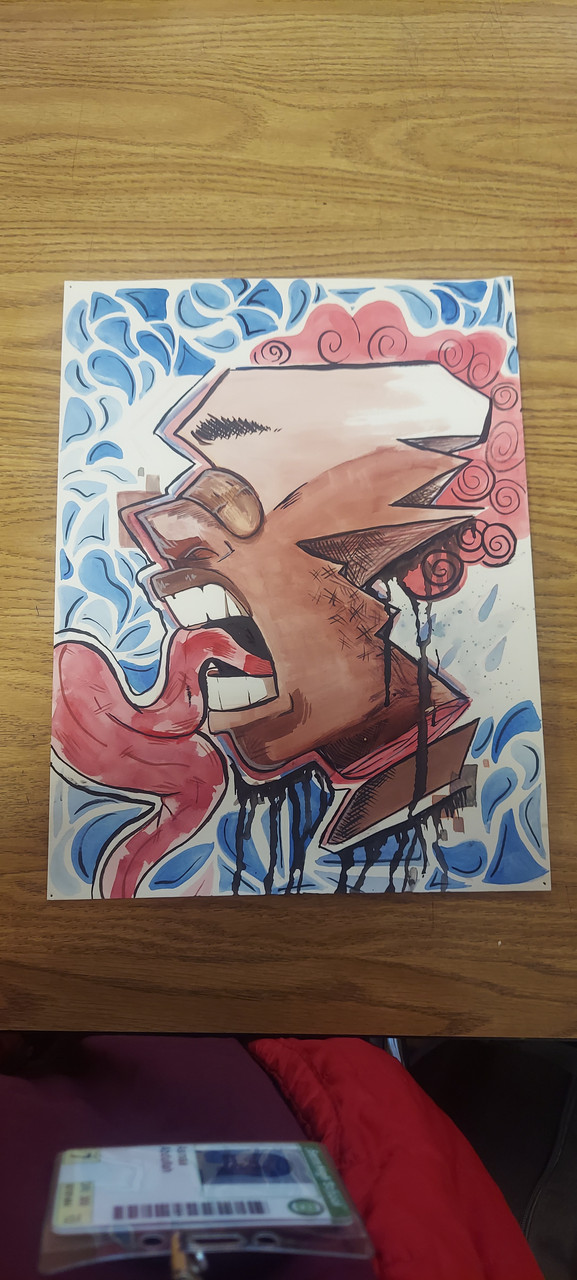 A man in profile with a long tongue.