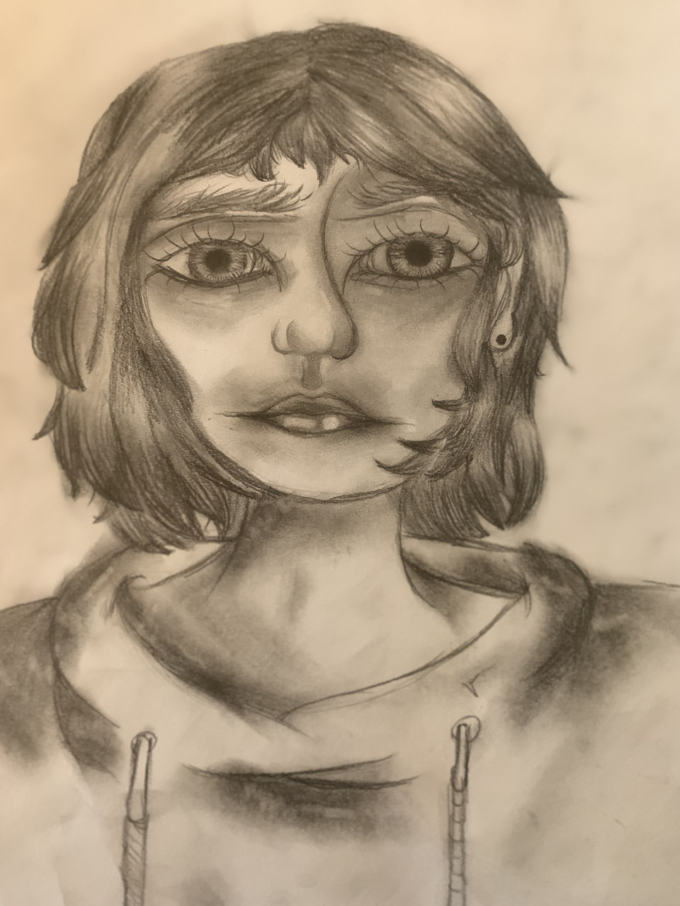Portrait with in depth shading of a young person wearing a long stringed hoody.