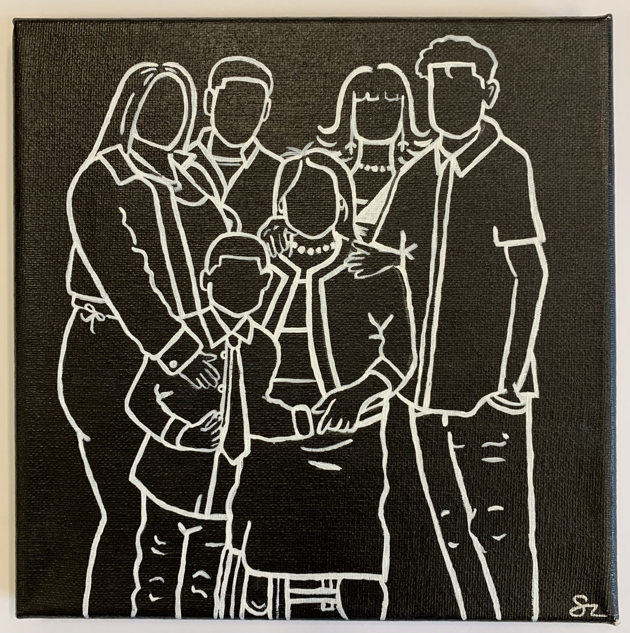 Black background with white outlines of a family