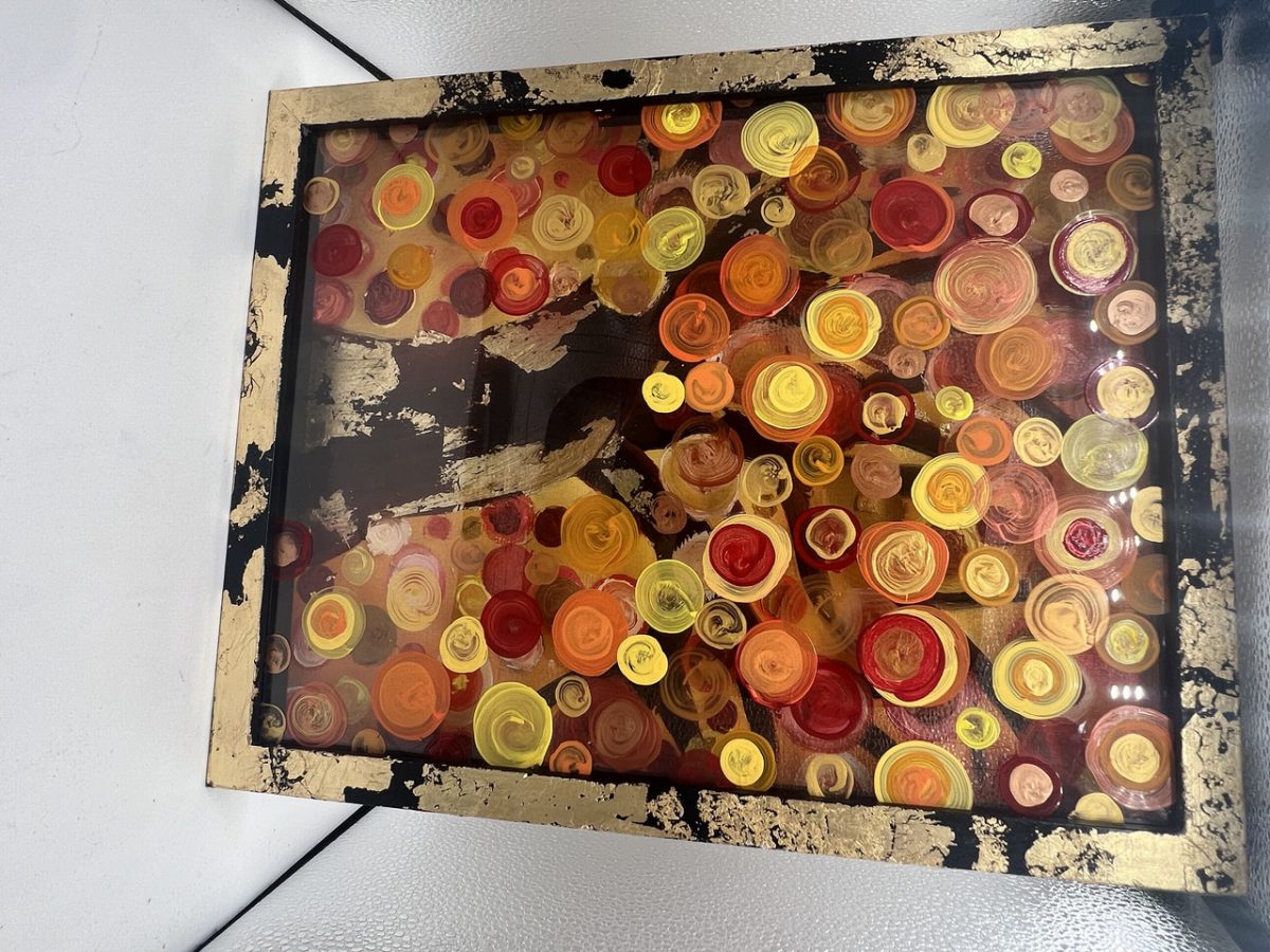 Tree with orange spirals with an gold paint.