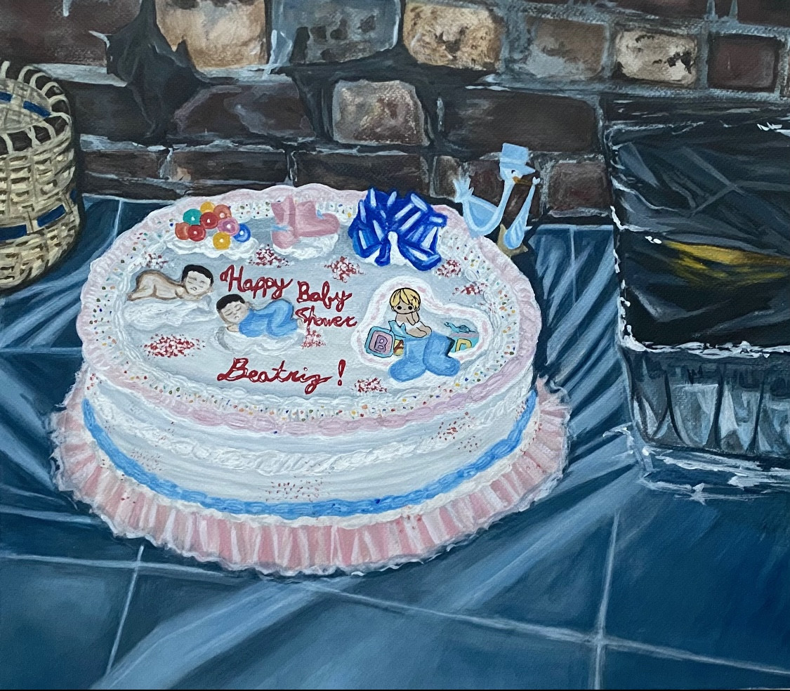 Birthday cake with blue table cloth.