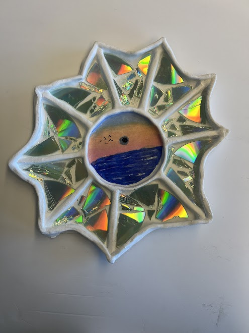 White tray, section with CD with a circular center