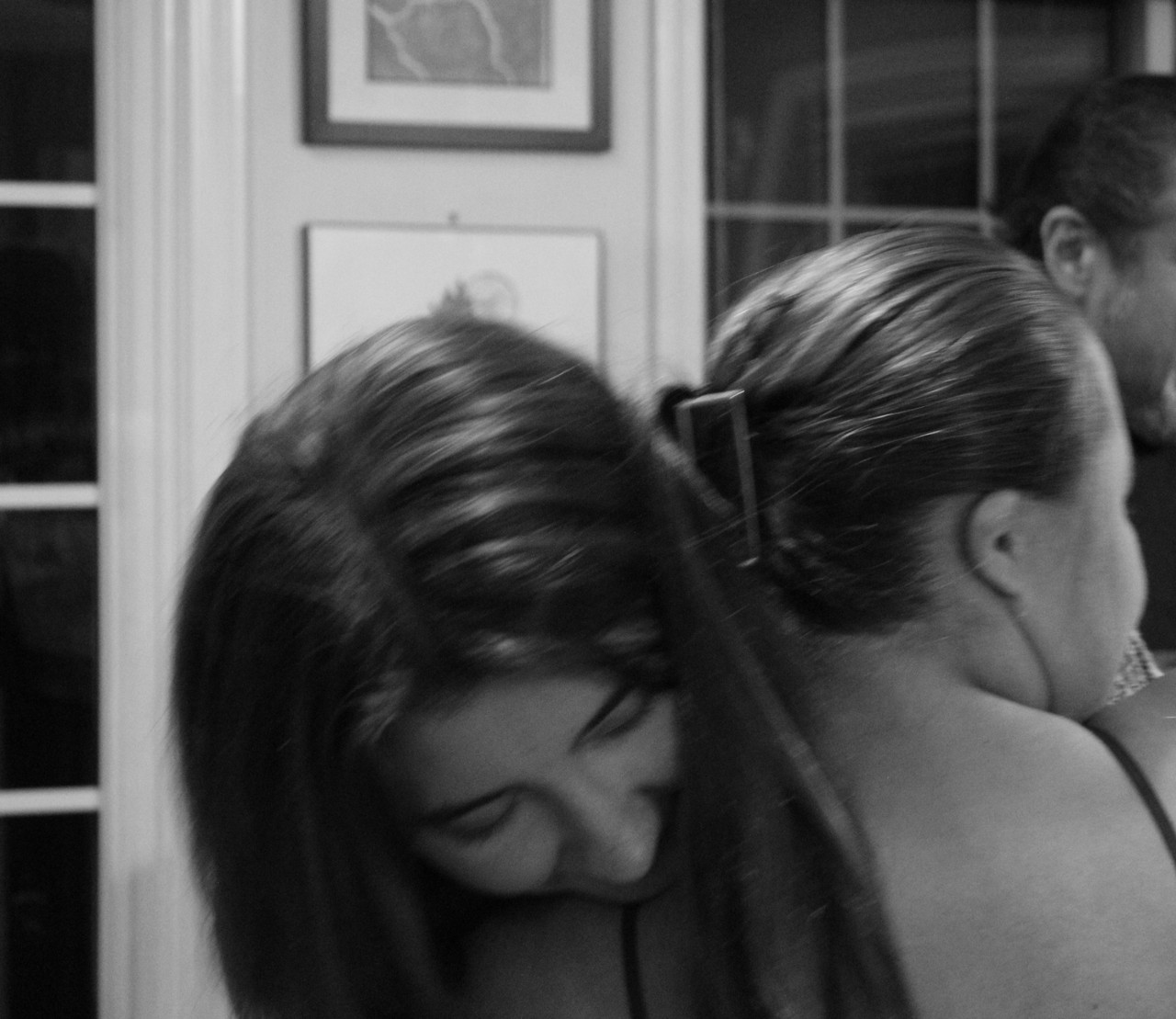 Two women hugging in black and white photo