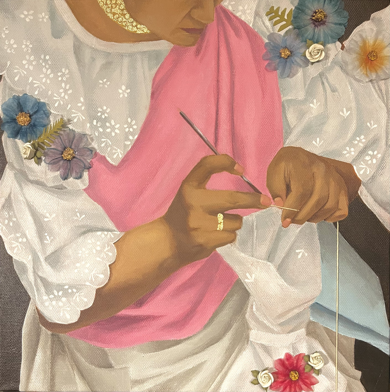 Older woman sewing designs on fabric