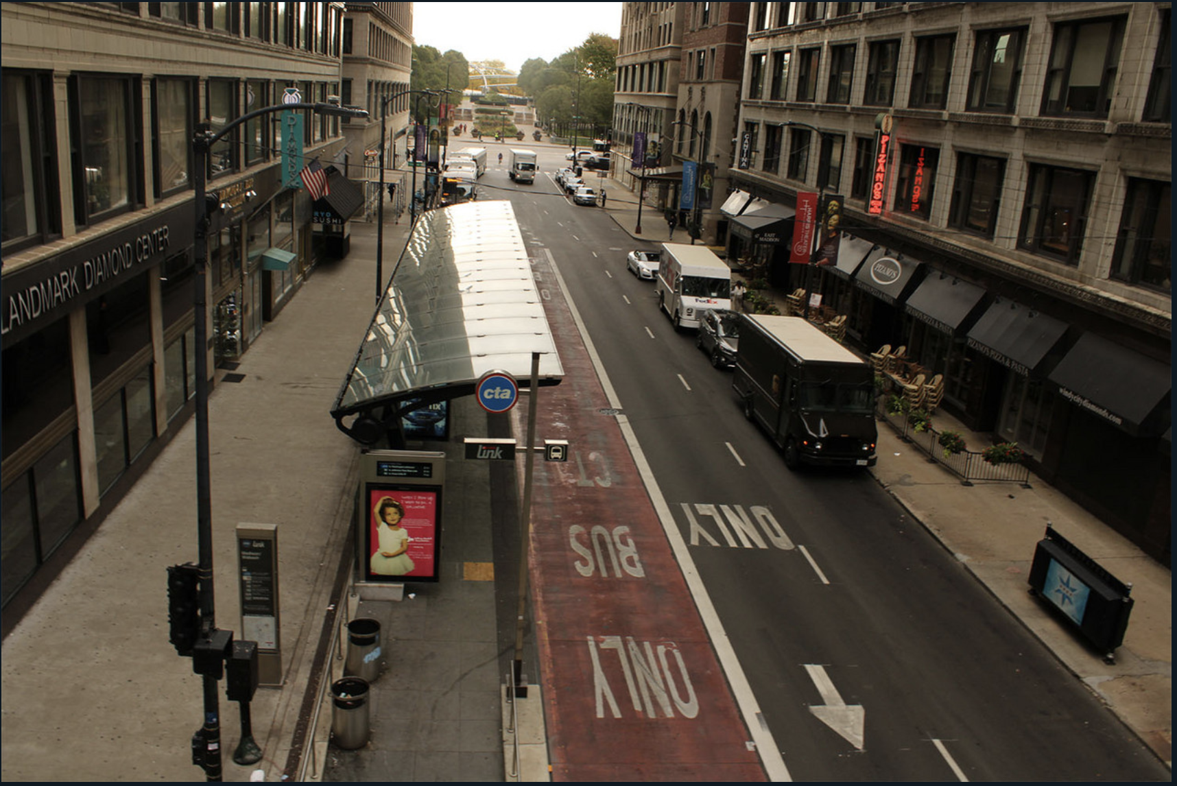 Downtown street with bus stop.