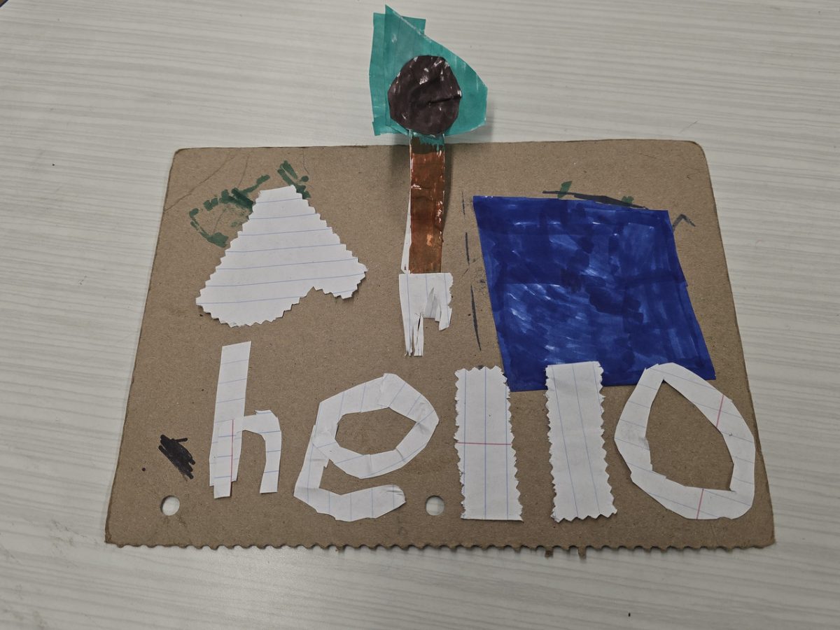 A paper construction, creating the word "hello" with other elements above.