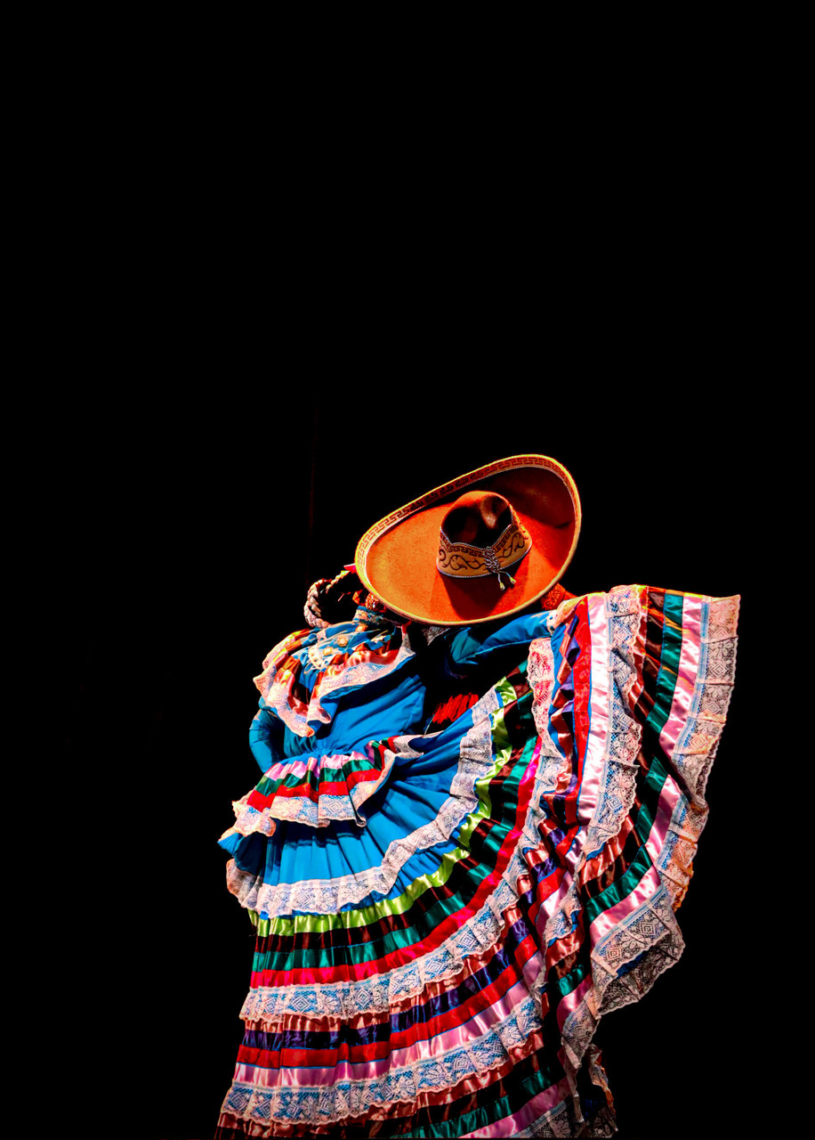 Image of two figures dancing. One figure in large hat is dipping woman in many skirts.