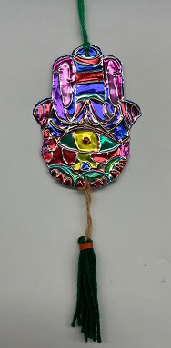 Hamsa hand with tassle made from embossed foil and yarn.