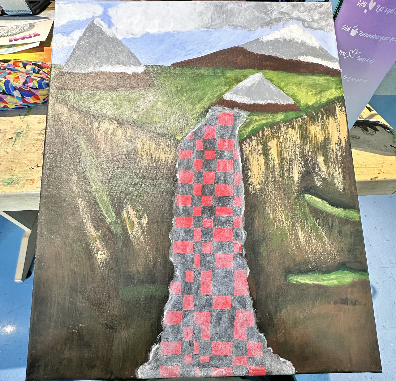 Mountain cliffside with a tear in the middle exposing a red and black checkered pattern