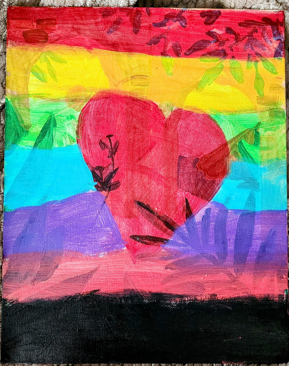 Pink heart in the center. Stripes in rainbow colors in the background.