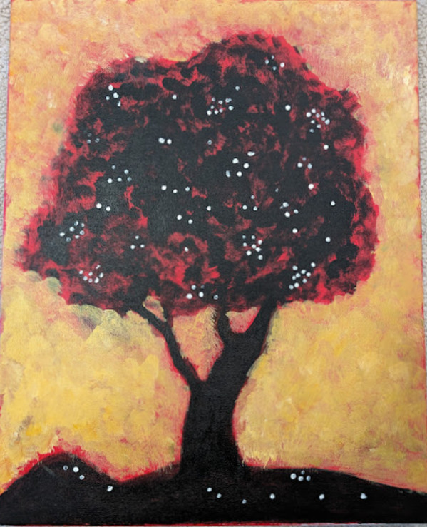 Tree with red leaves that appears to be glowing in front of yellow background.