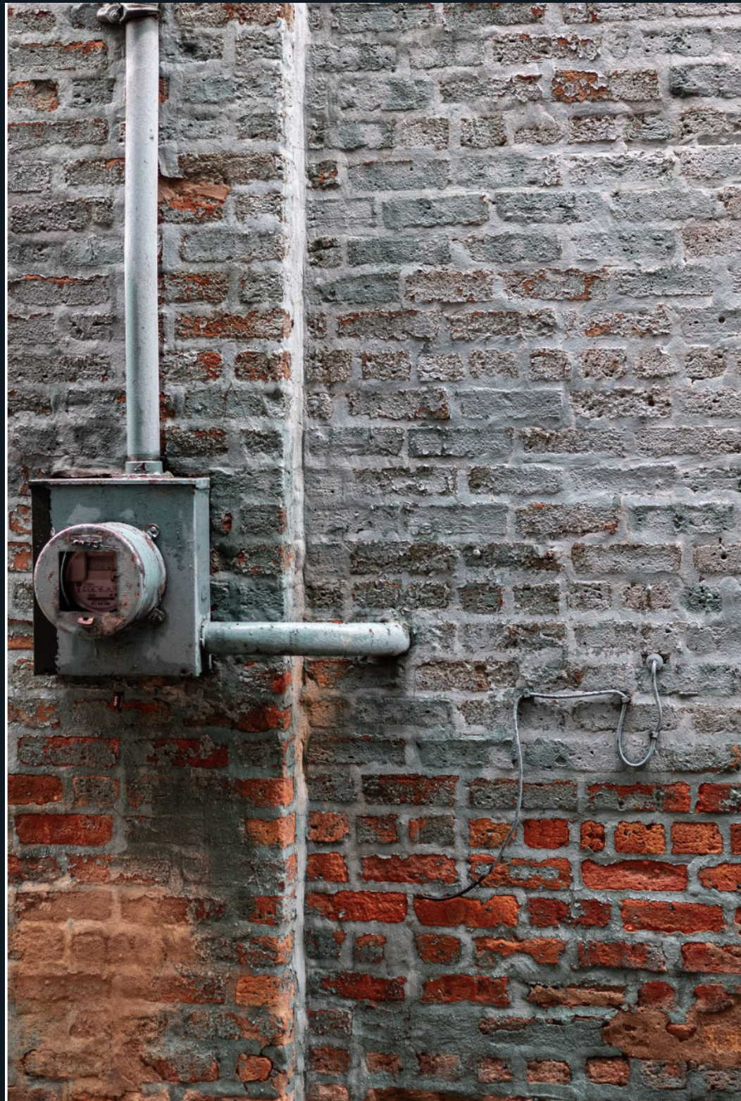 Brick wall with meter.