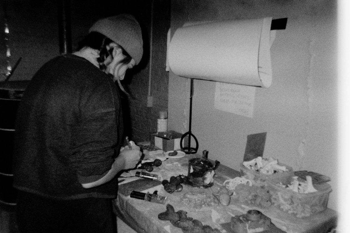 Girl painting a sculpture in an artist studio