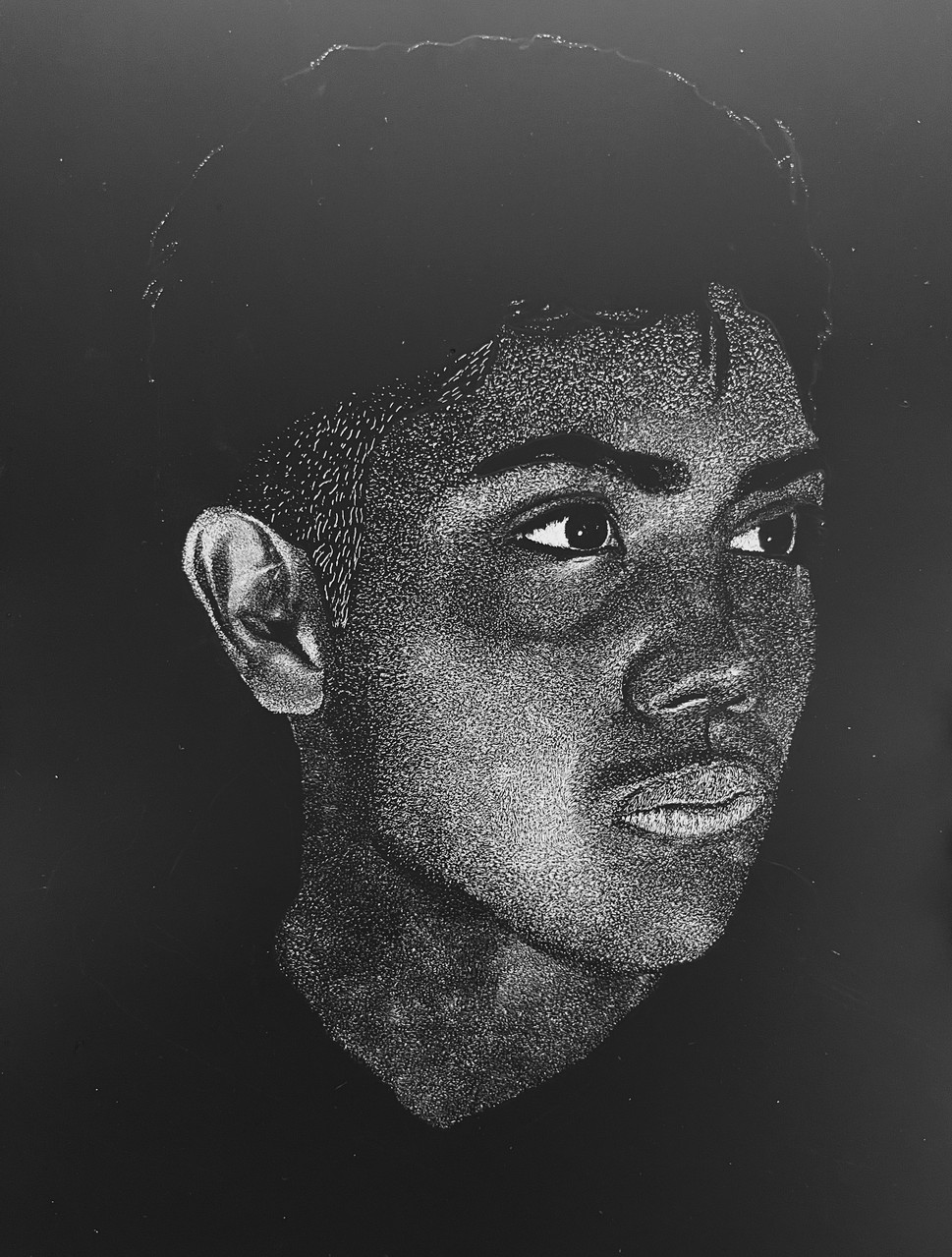 Black and white self portrait of a young man.
