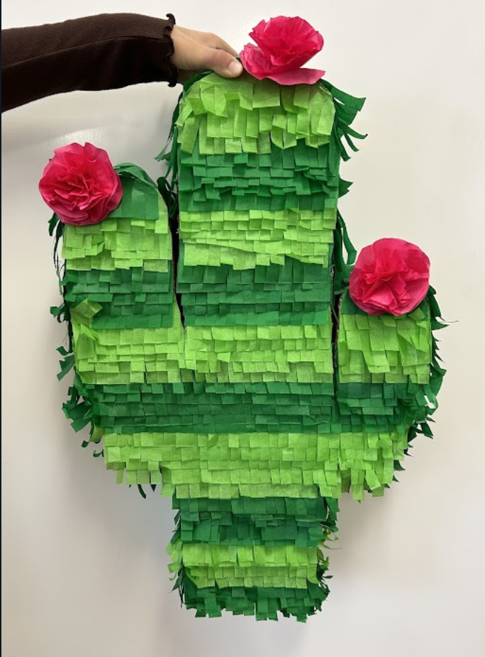 Green and pink paper build of a cactus.