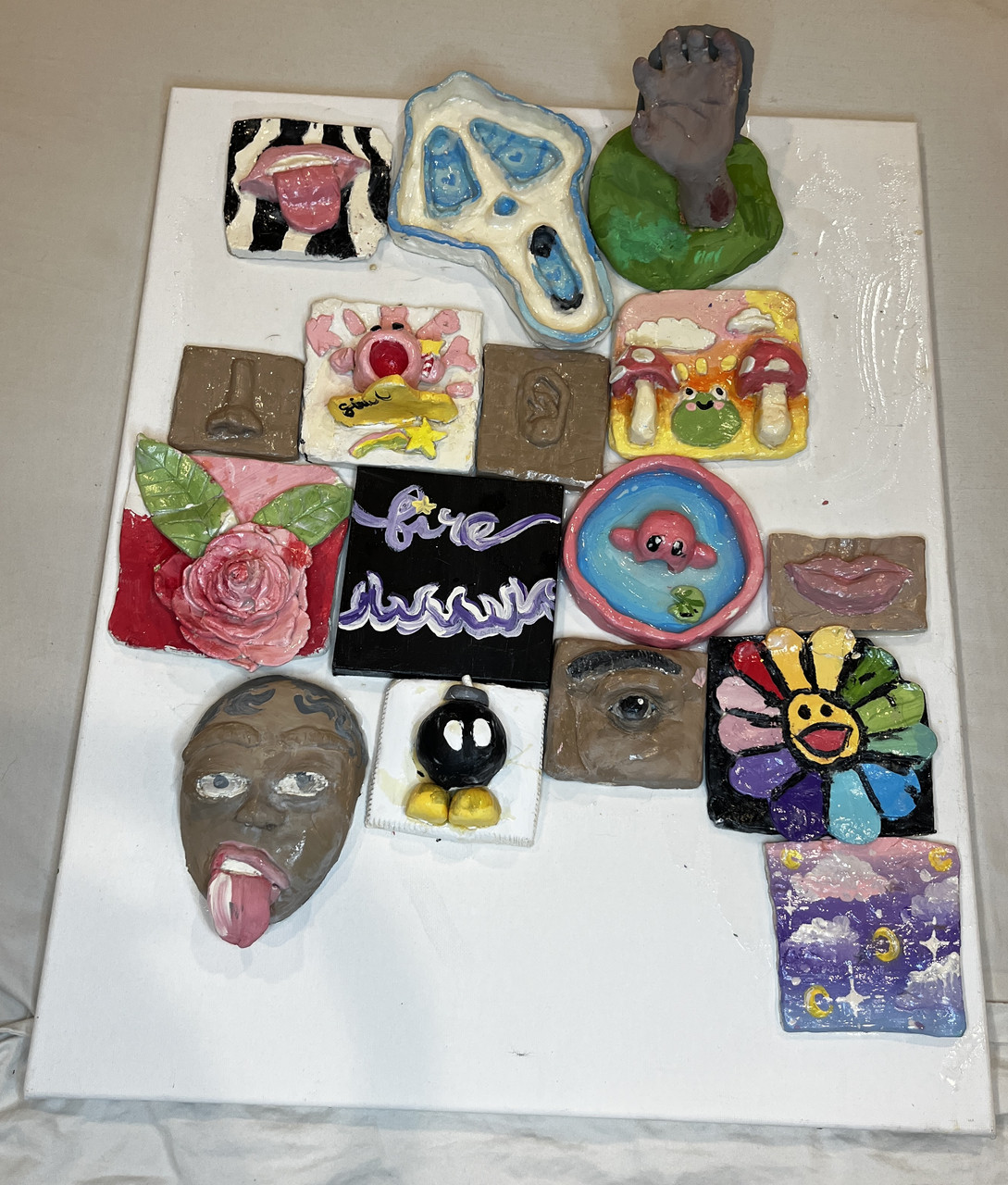 Canvas, clay, paint, mod podge, markers, glue