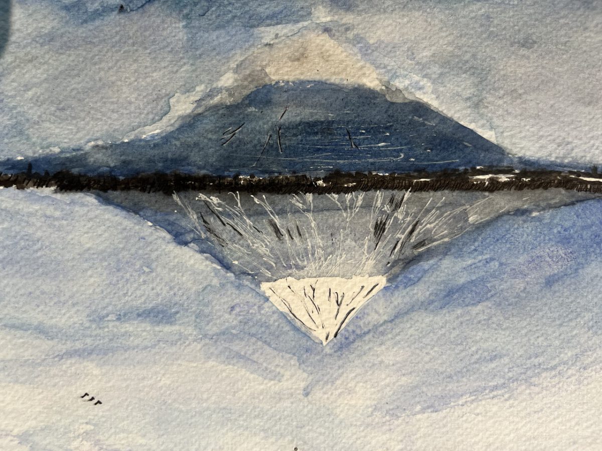 Mountain reflected off of a body of water