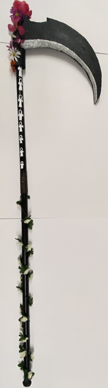 A scythe with flowers at the top of the handle and vines around