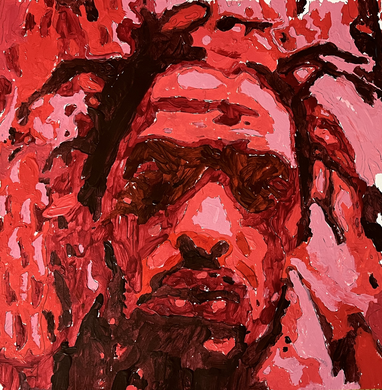 A portrait painted with black and red