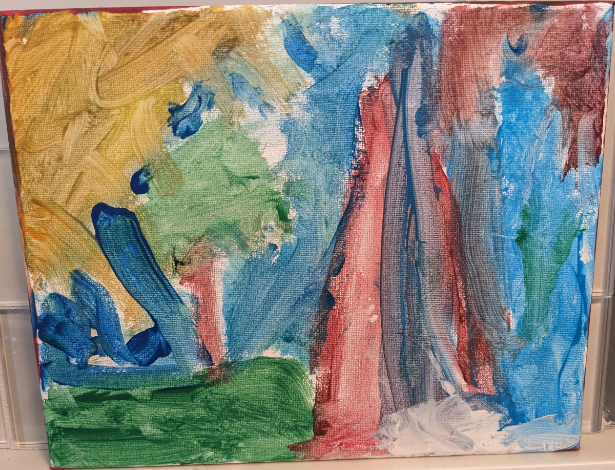 Sun shining down on tree and mountain. Mountain is blue and red.