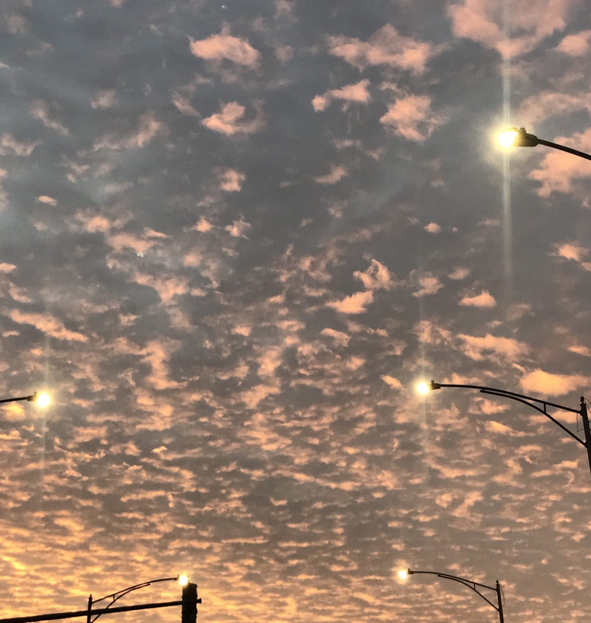 Photograph of cloudy sky with blue pink and orange