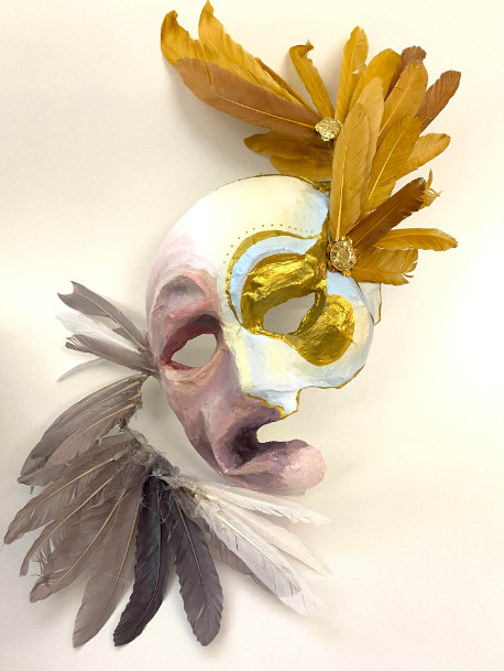 Multi-colored mask with feathers and gold accents