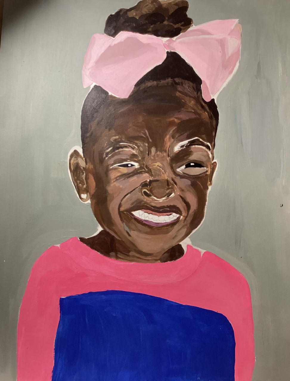 Artwork of young person with pink bow and pink and blue shirt