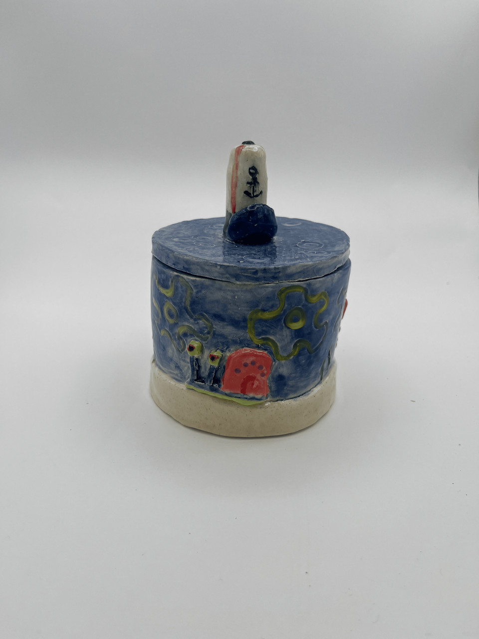 Photograph of blue sculpture with characters from spongebob and spongebob hat on top