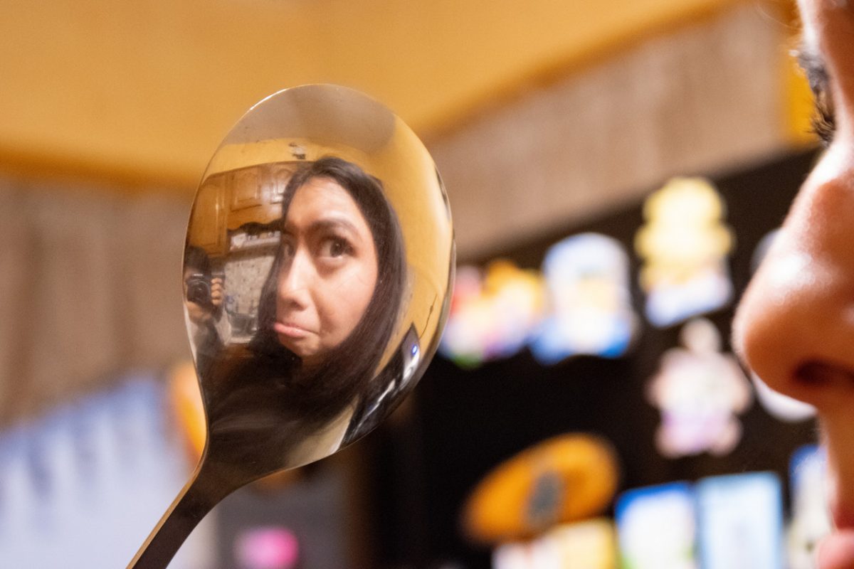 Close up image of reflection of person in spoon