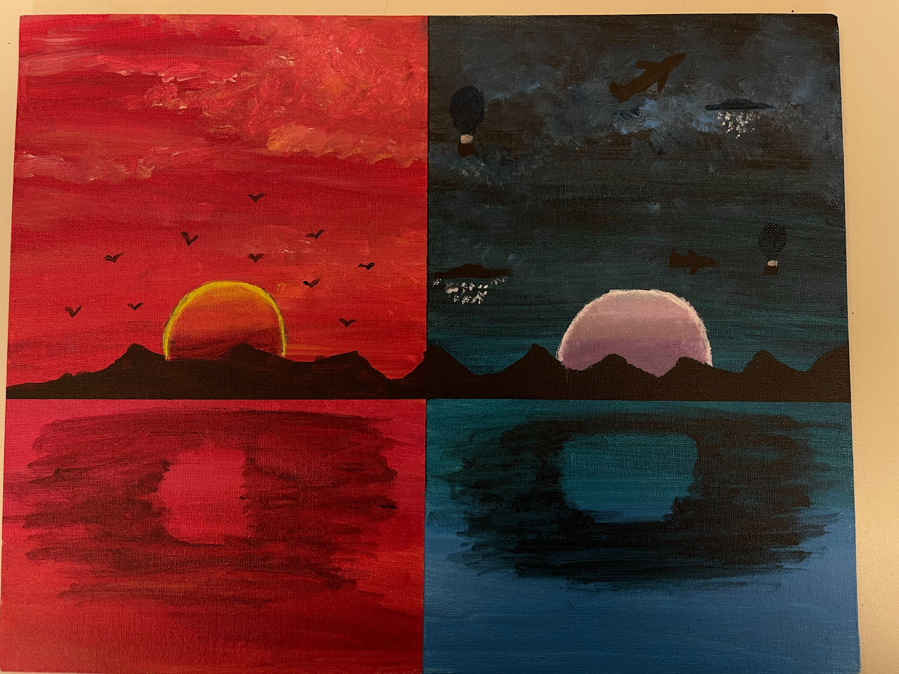 Painting with split sides, one red and yellow toned, and the other blue and black toned