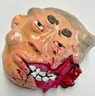 Sculpture of mans face with cheek open showing gums and inside of mouth