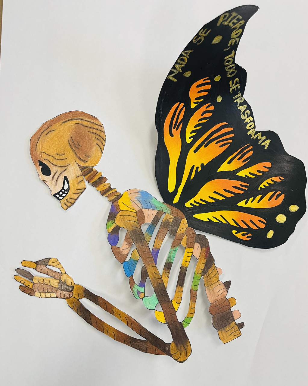 Mixed media artwork of skeleton with multicolored ribs and butterfly rings