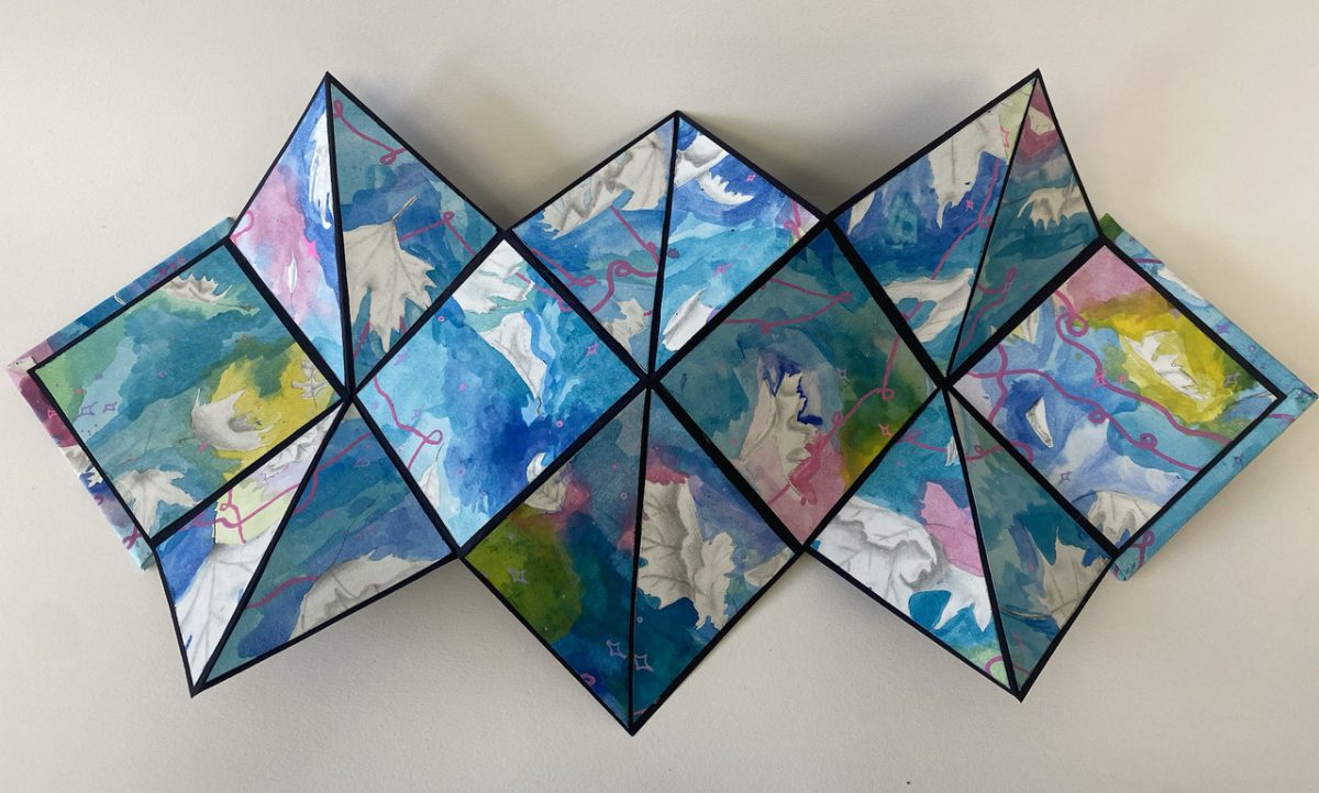 Fold out multi-colored artwork with black lines across folds featuring blues greens pinks and yellows blended together