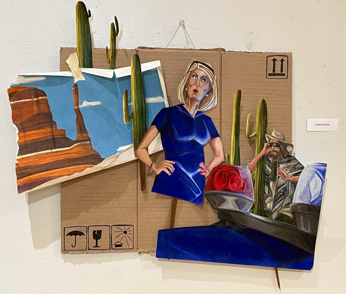 Mixed media collage with cardboard background and layered images of a dessert, cactuses, a woman with blonde hair in blue dress with hands on hips, and man getting out of police car showing lights on top