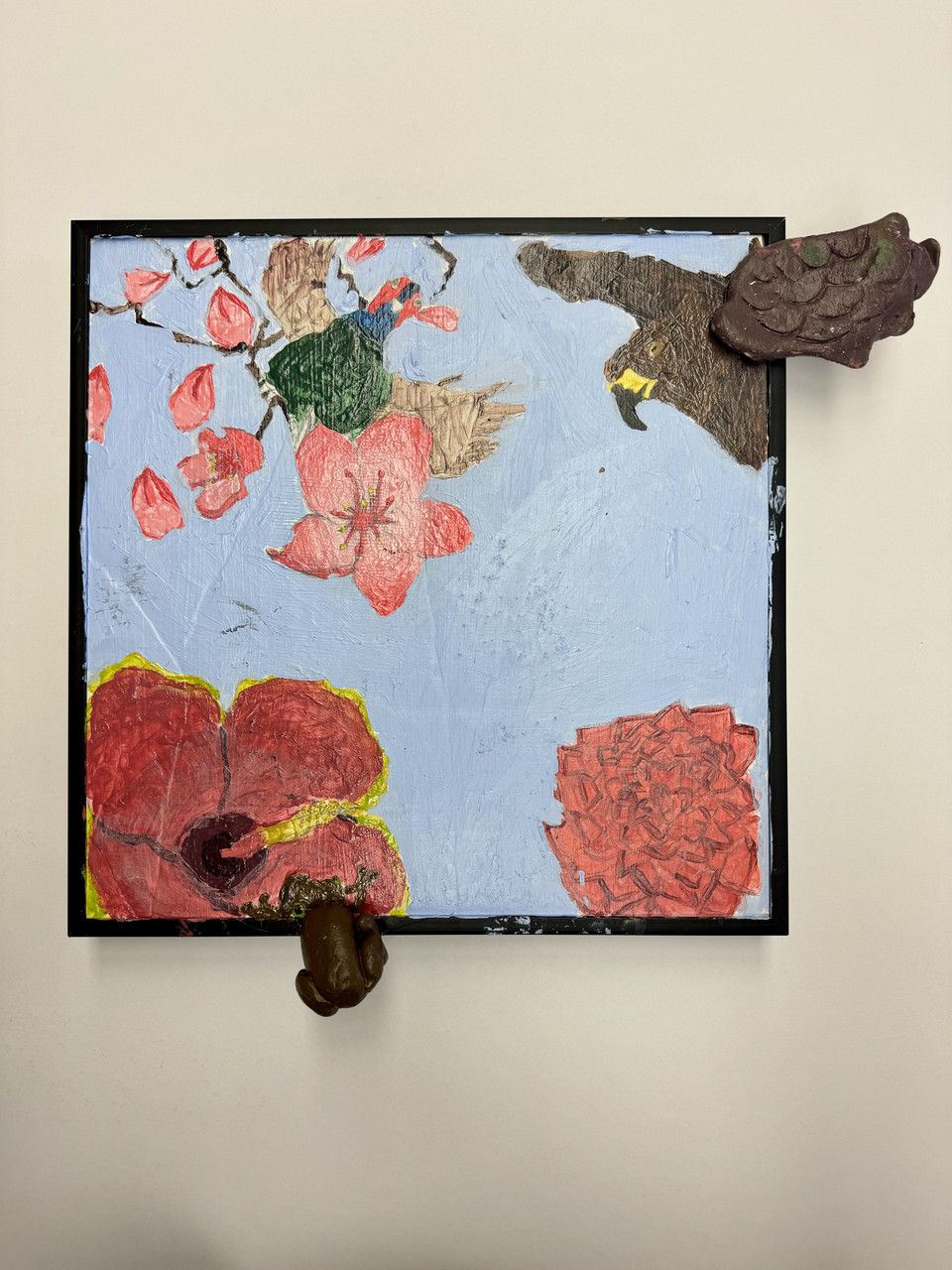 Mixed media artwork with painting of pink flowers and brown and green birds, with clay wing attached