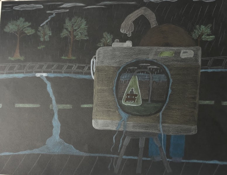 Black paper with multi-colored pencil drawing featuring road with trees in background, and person behind camera taking a photo of a person sitting on a bench under a street light